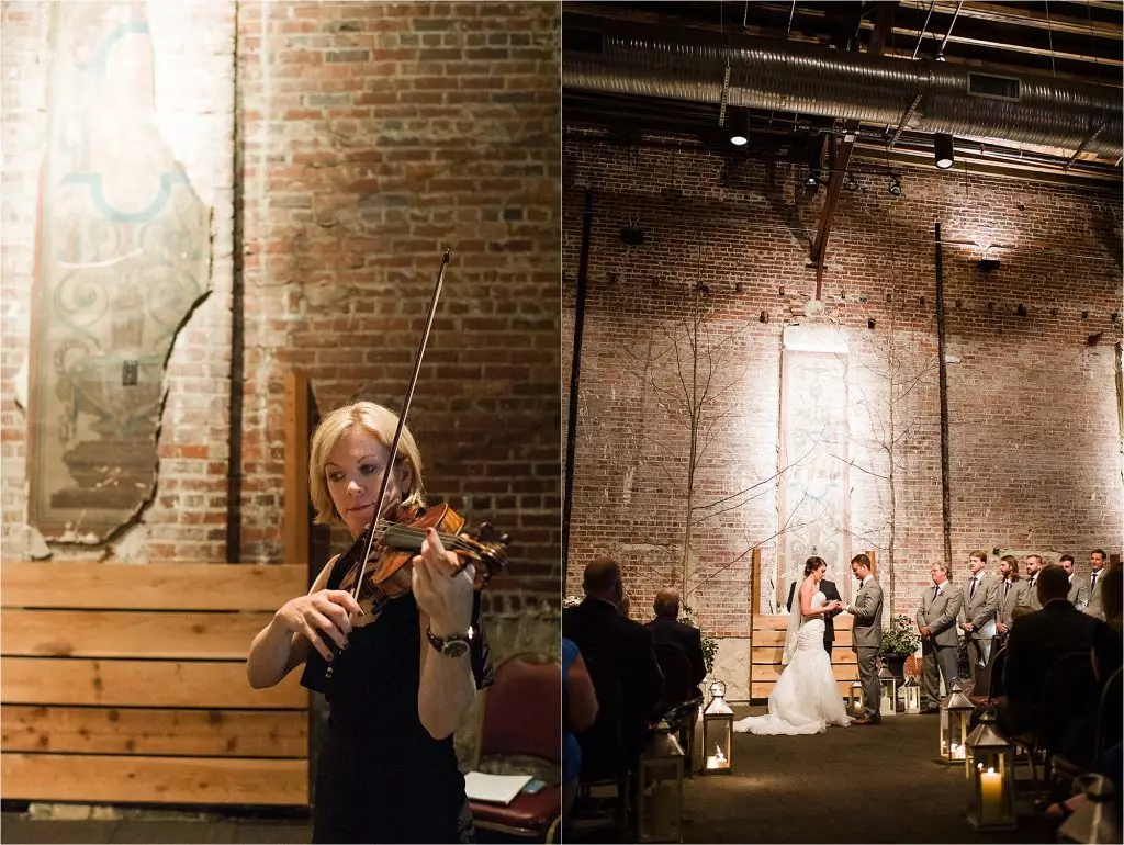 bride and groom with violinist inside wedding avon theatre
