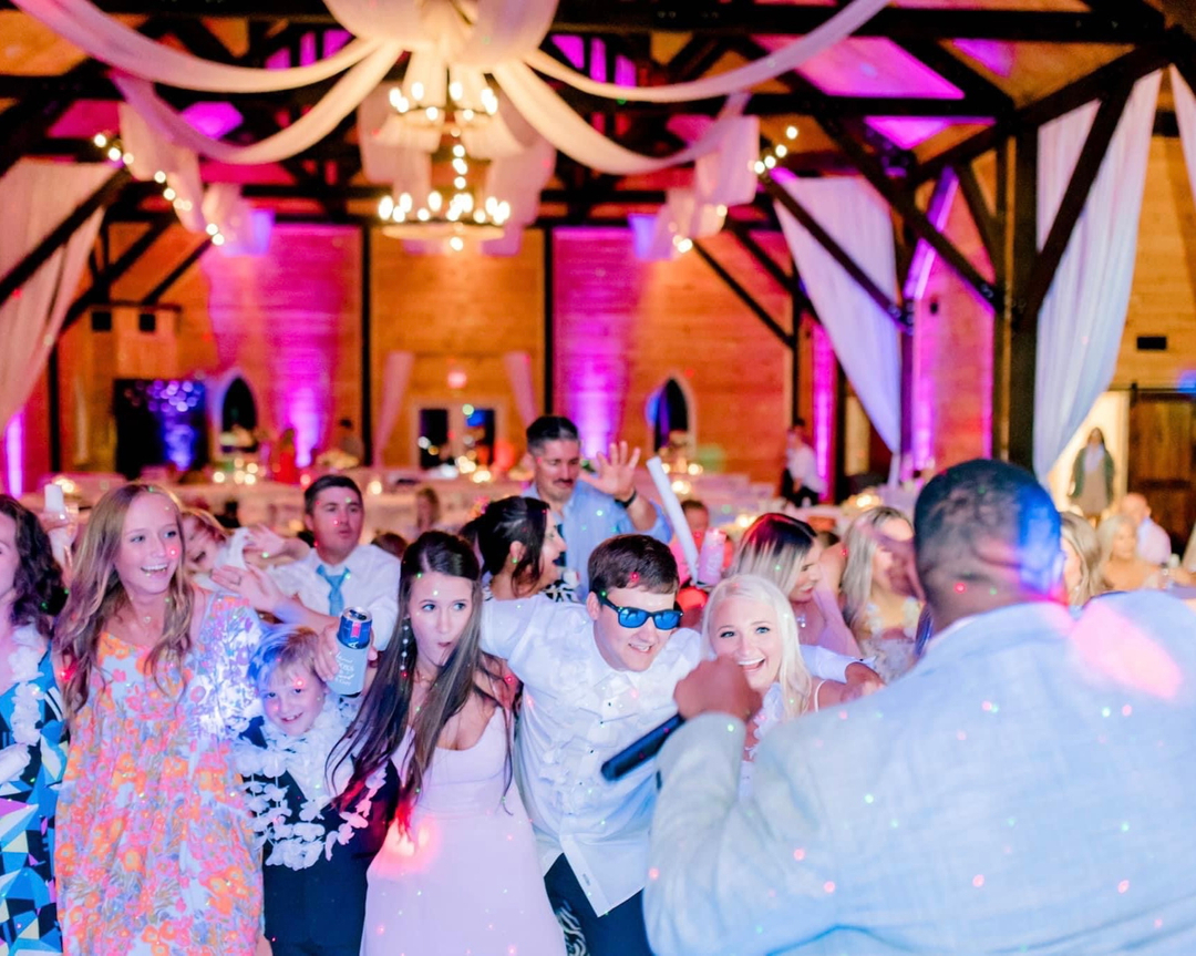 wedding dance party dance floor with emcee inside legacy at serenity farms