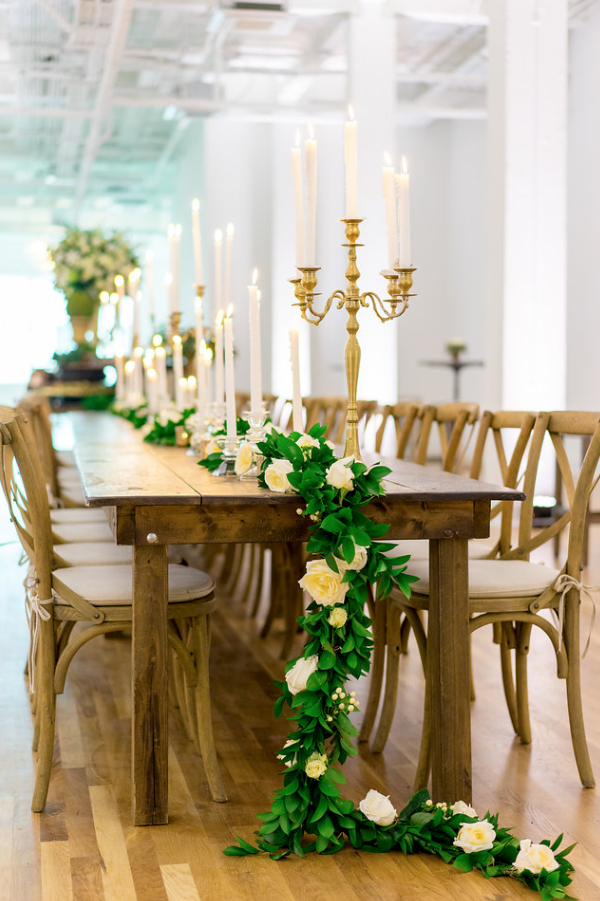 long table with garland and candle sticks inside kress building