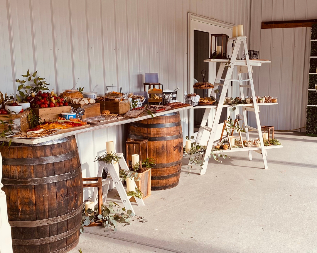 rustic table and shelves with food and drink at legacy at serenity farms