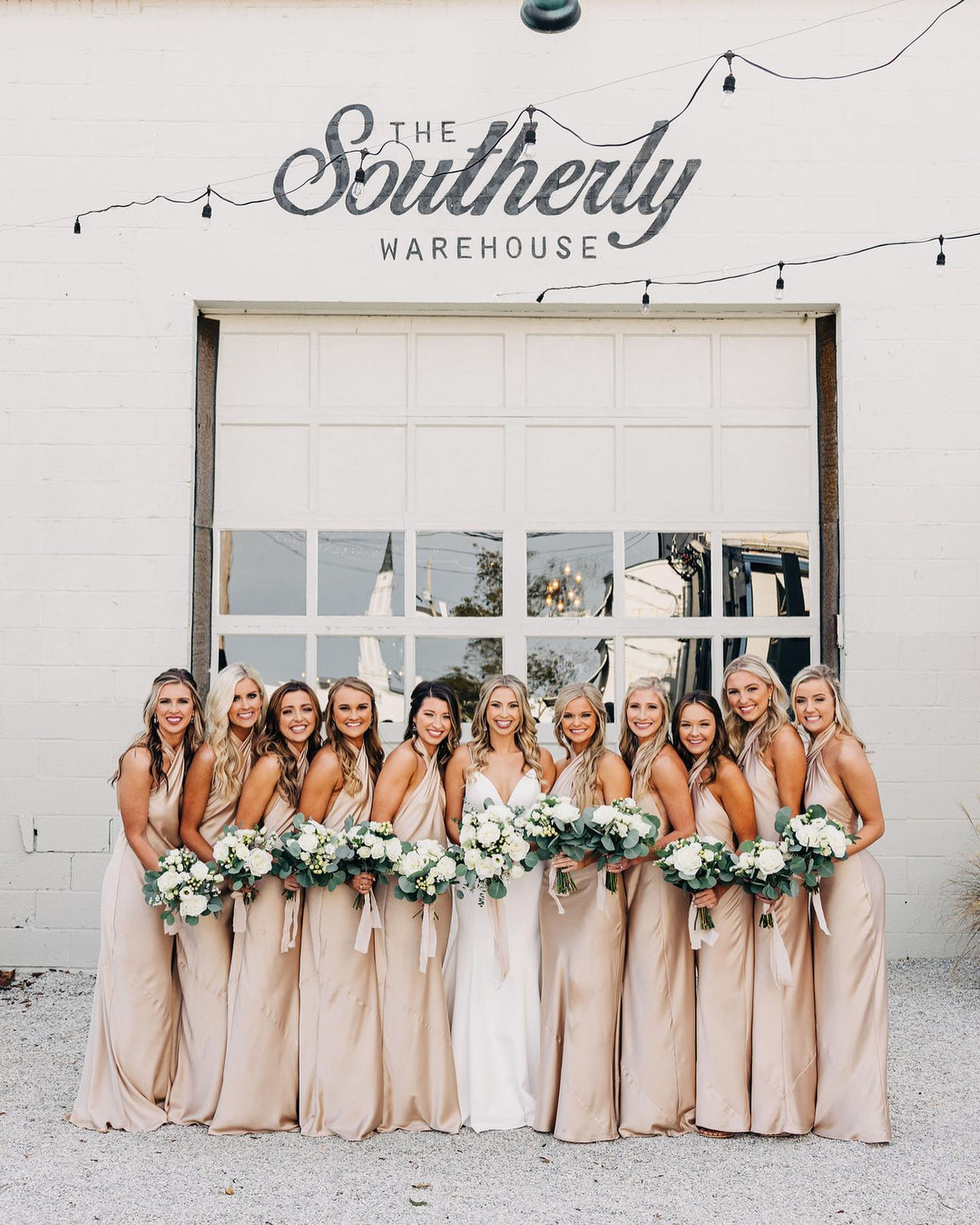 bridal party photographed outside the southerly warehouse wedding