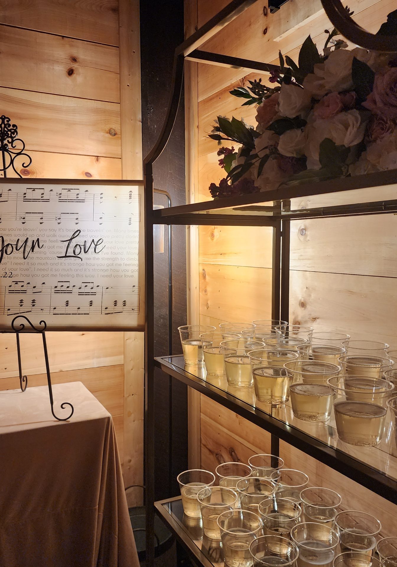 gold shelves with bnb beverage management champagne and wedding welcome sign