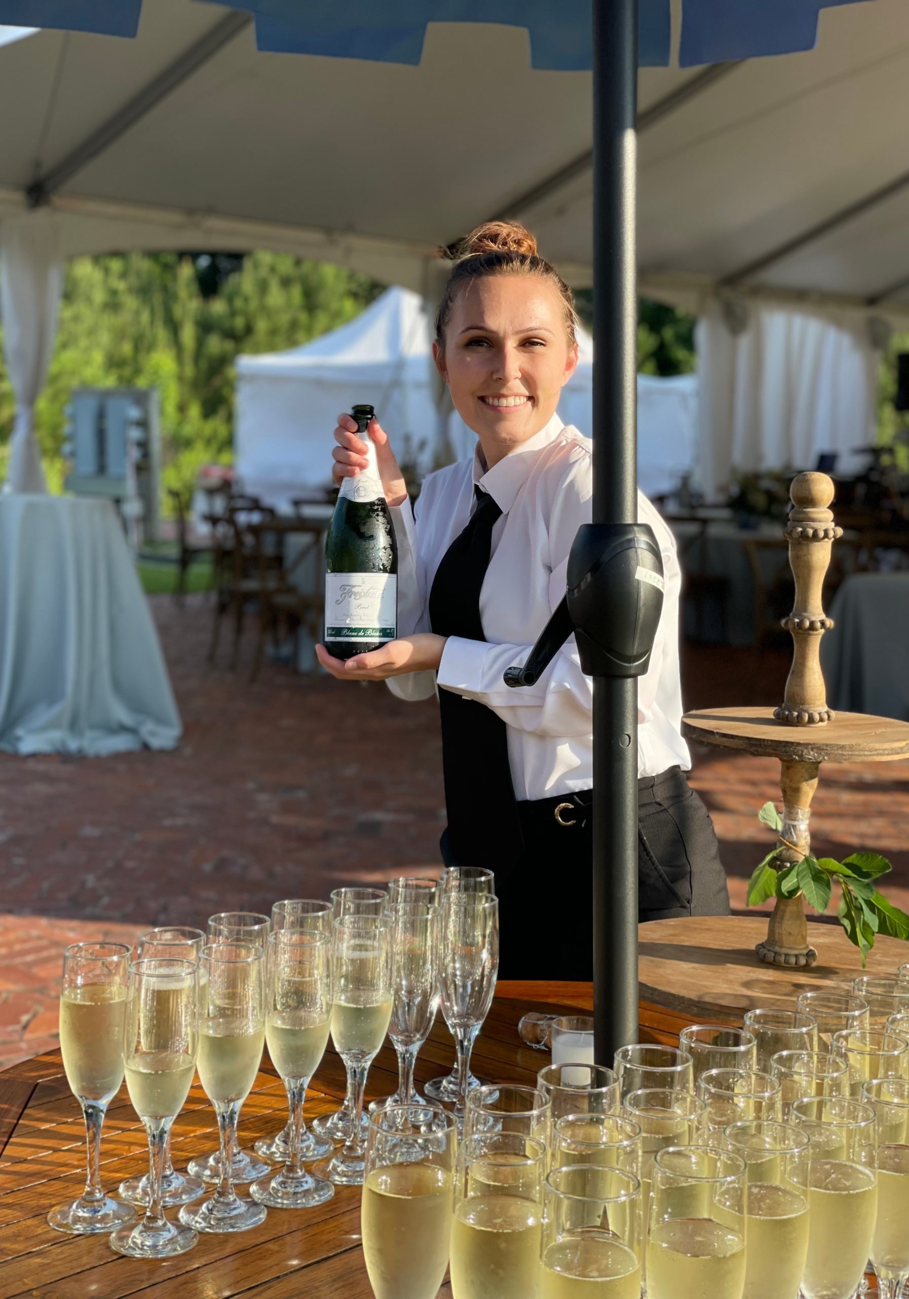 BNB Beverage Management bartender serving champagne at wedding at parker hill