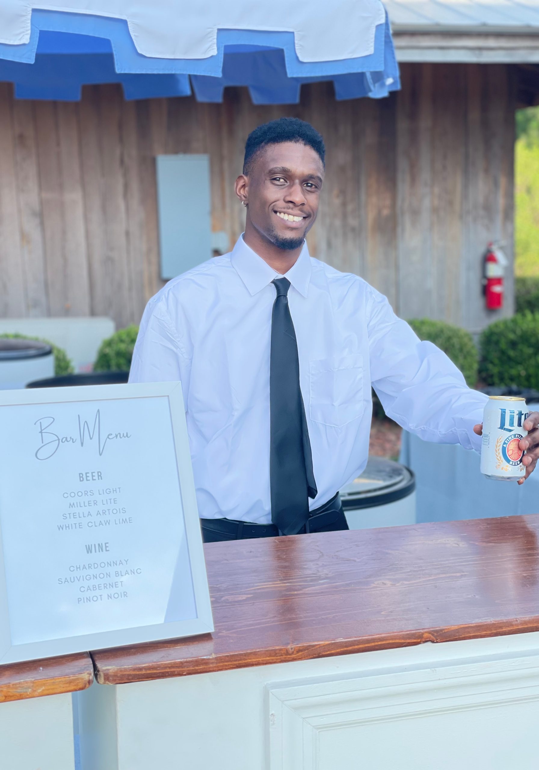 BNB Beverage Management Bartender serving alcohol at outside bar parker hill