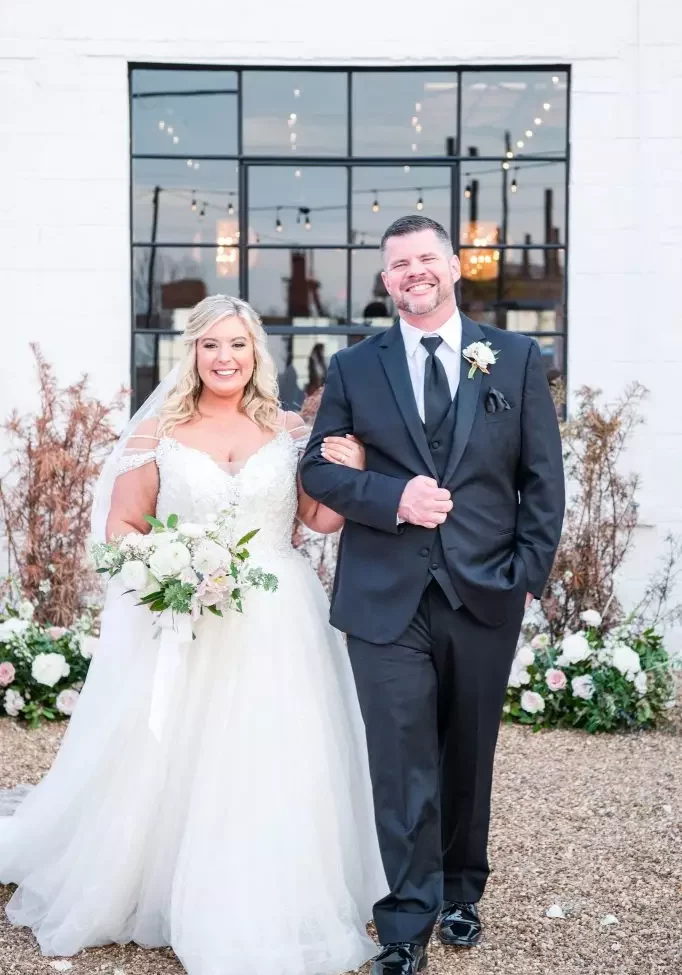 bride and father smiling walking down isle at avenue d wedding