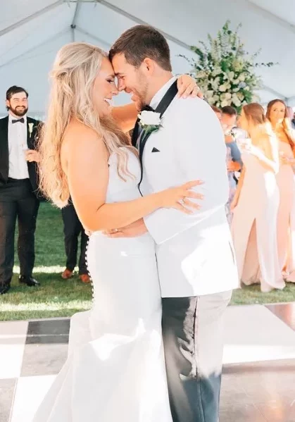 bride and groom dancing outside