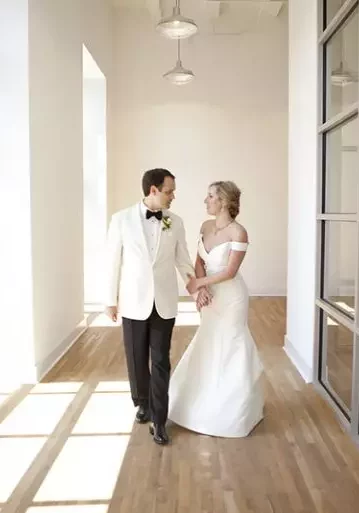 bride and groom inside posed for wedding portrait