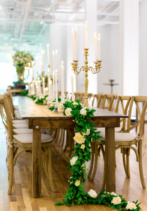 long table with garland and candle sticks inside kress building