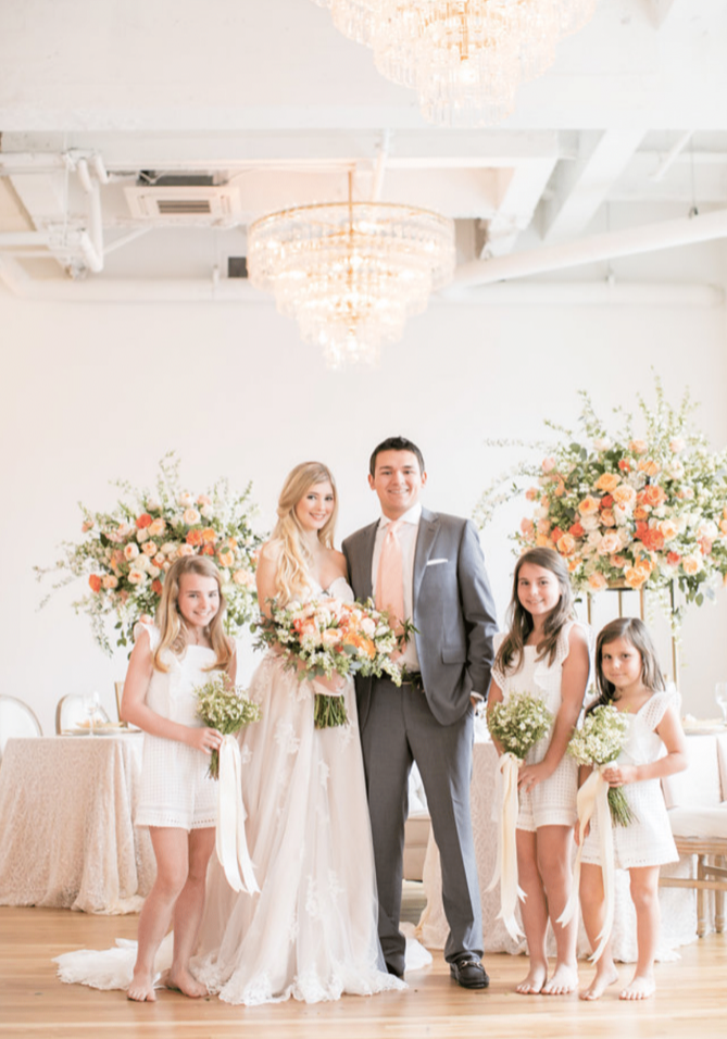 Wedding family portrait with florals at wedding