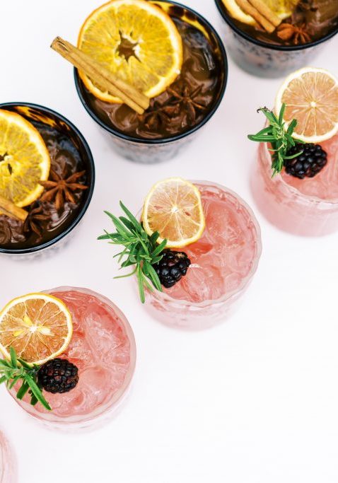 signature cocktails pink drink fruit garnishes