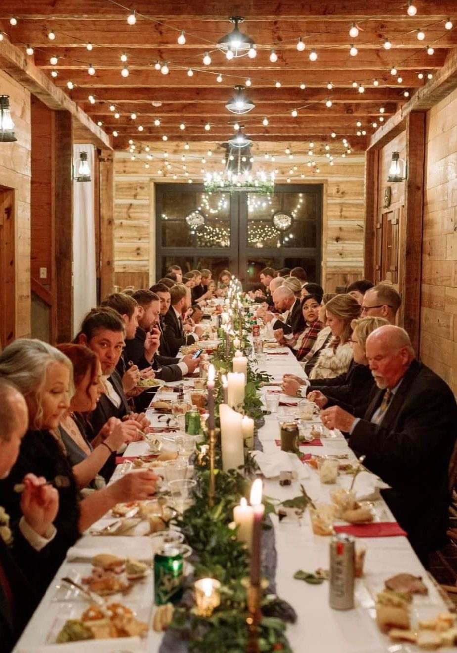 long table decorated for wedding guests dinner