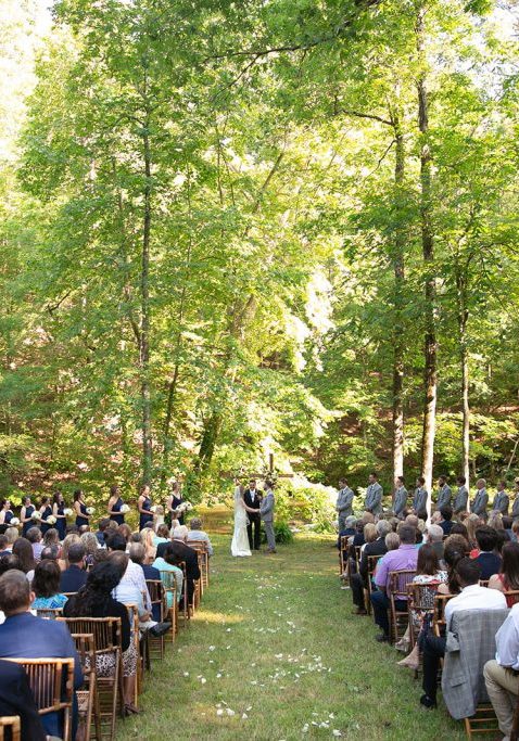 wedding set up with chairs bride and groom outside swan lake stables