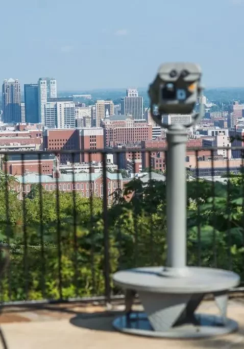 coin operated viewer overlooking birmingham skyline at the vulcan