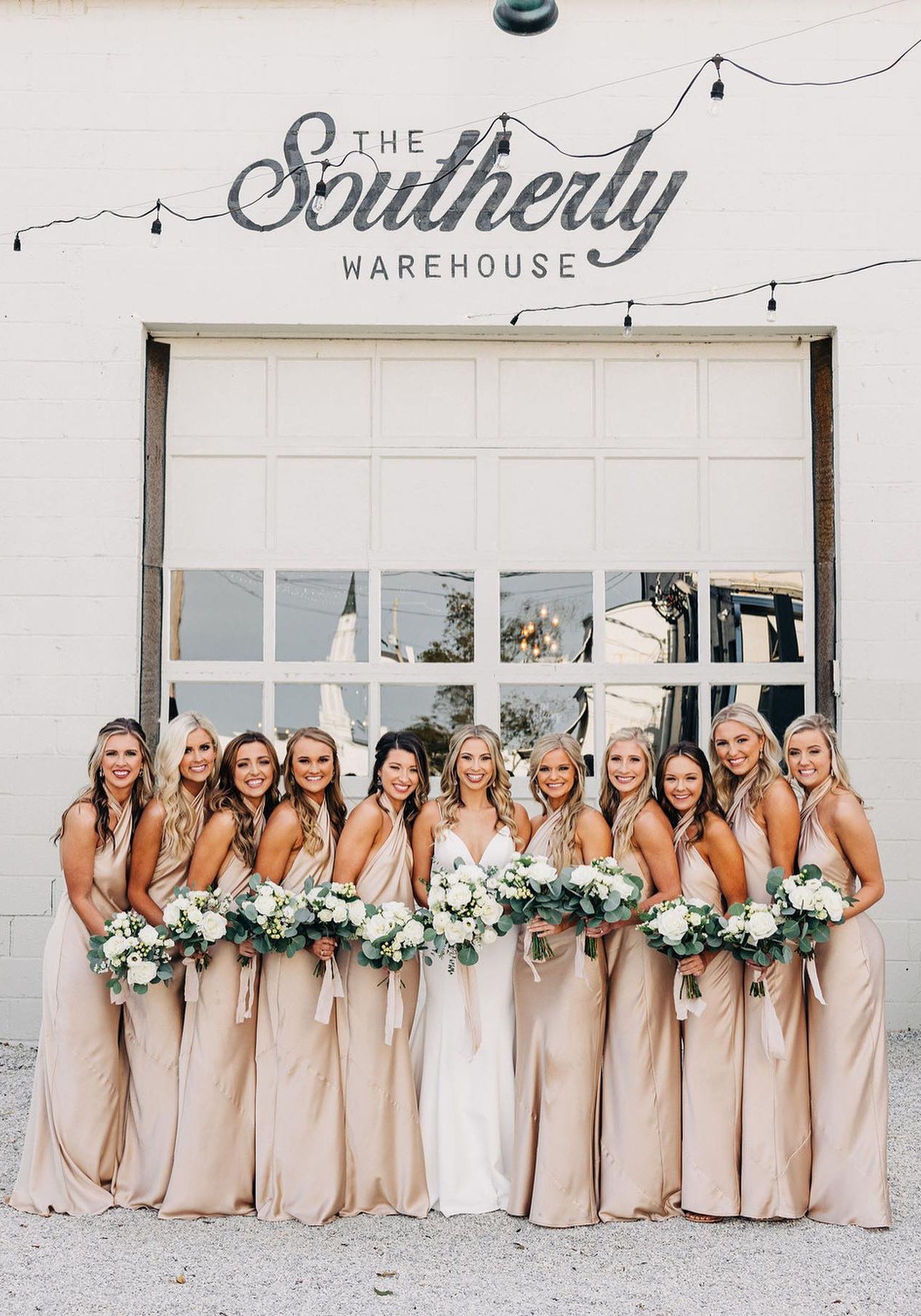 bridal party photographed outside the southerly warehouse wedding